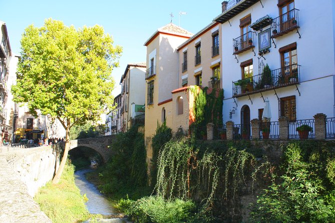 Albayzin and Sacromonte Guided Walking Tour in Granada - Meeting in Plaza Isabel la Católica, then heading for the river Darro