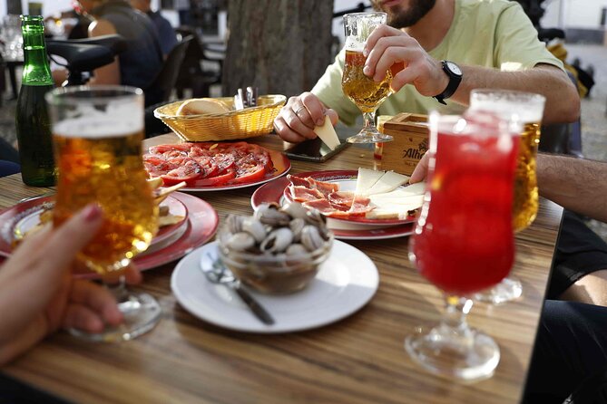Granada Highlights Tour with Tapas Breaks by Electric Bike - Viewpoints with Alhambra and Sierra Nevada behind the rooftops