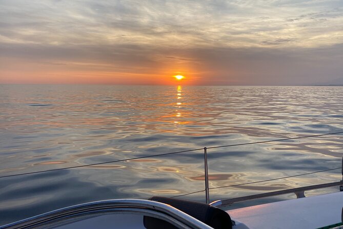 Sailing at sunset along the cliffs of Maro-Compartida - La Herradura Meets Maro-Compartida, One Big View at Sunset