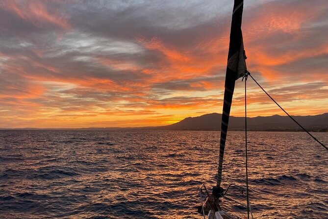 Sunset sailing along the cliffs of Maro- Private - The Bavaria 37 Experience, Comfort and That Calm-Boat Feeling